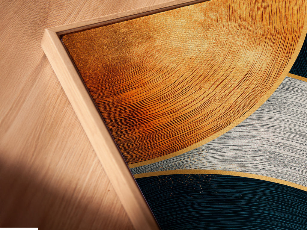 A close-up angled view of a canvas print in a floating frame. Showcasing an abstract geometric artwork with teal navy and gold curved lines. This contemporary art piece adds a modern touch to any room. The floating frame enhances the artwork's visual appeal.