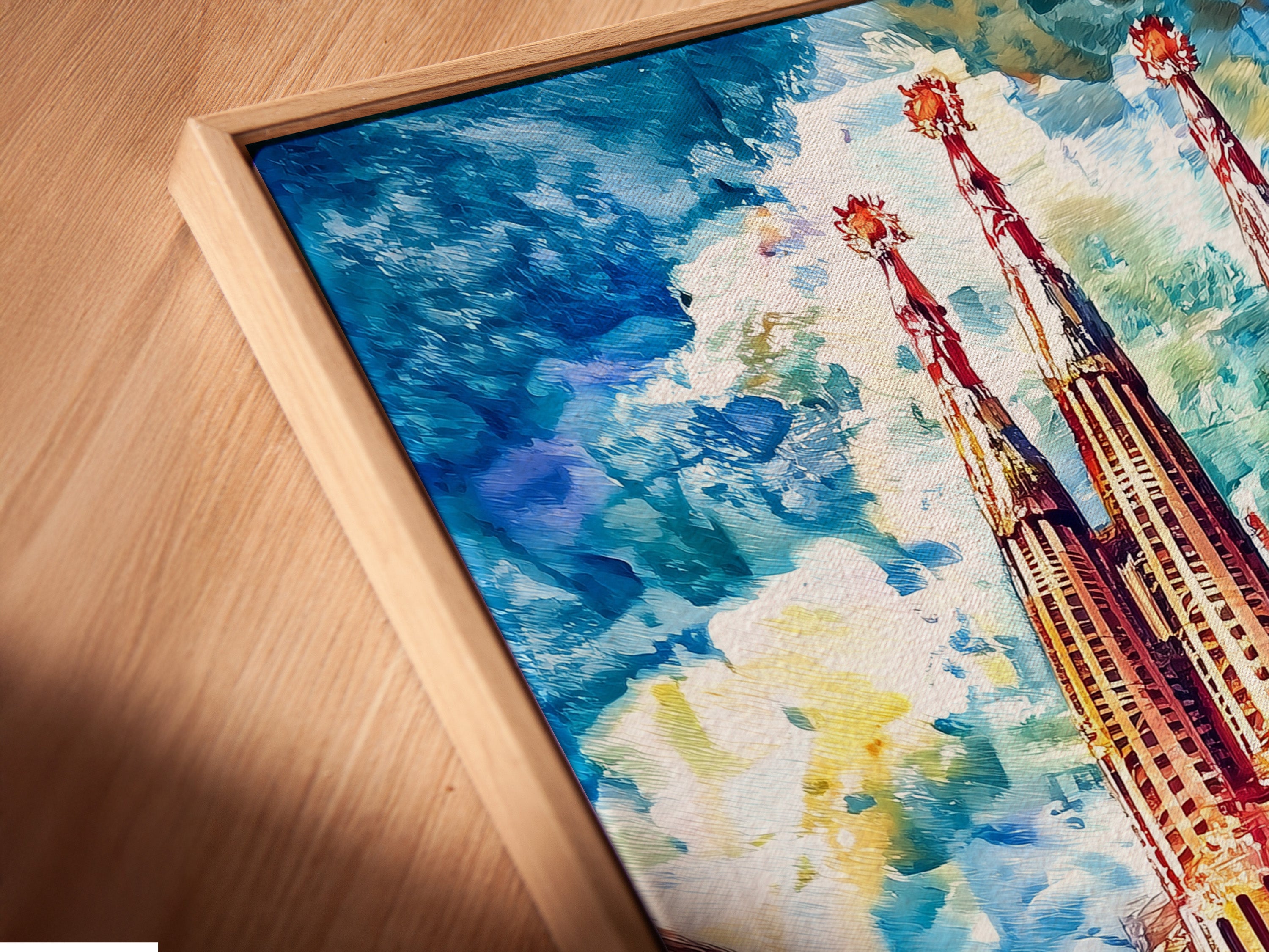 Close-up of a Sagrada Familia canvas print in a floating frame. The Barcelona wall art is a stunning gothic cathedral poster. It is ready to hang. Perfect for adding architectural artwork to your home or office wall decor.