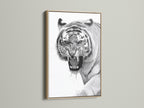 This is a close up of a majestic tiger artwork in an oak frame. The natural wood grain enhances the artwork. This art piece brings warmth and sophistication to your decor. It is ideal for creating a focal point in your living space. The oak frame complements any interior.