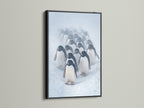 Penguin Parade art print in a sleek black frame. The black frame provides a striking contrast to the winter wildlife canvas. This penguin art makes a bold statement in any modern office or living space. Ideal for animal art.
