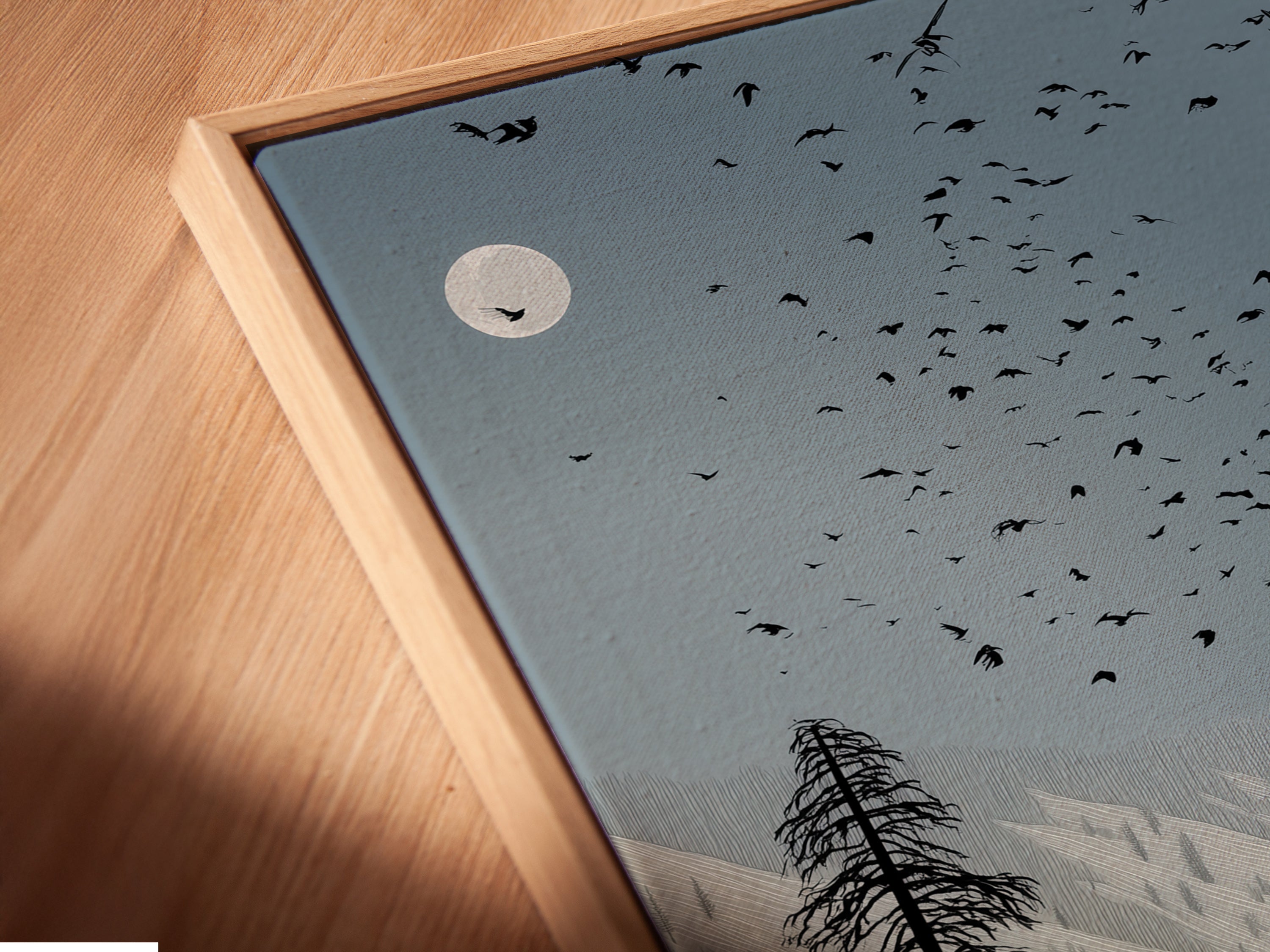 A close-up angled view of a canvas print in a floating frame. The rustic farmhouse artwork features an eagle over a barn. This fine art piece enhances any space. The floating frame adds a modern touch to the vintage landscape poster. Ideal for cabin decor.