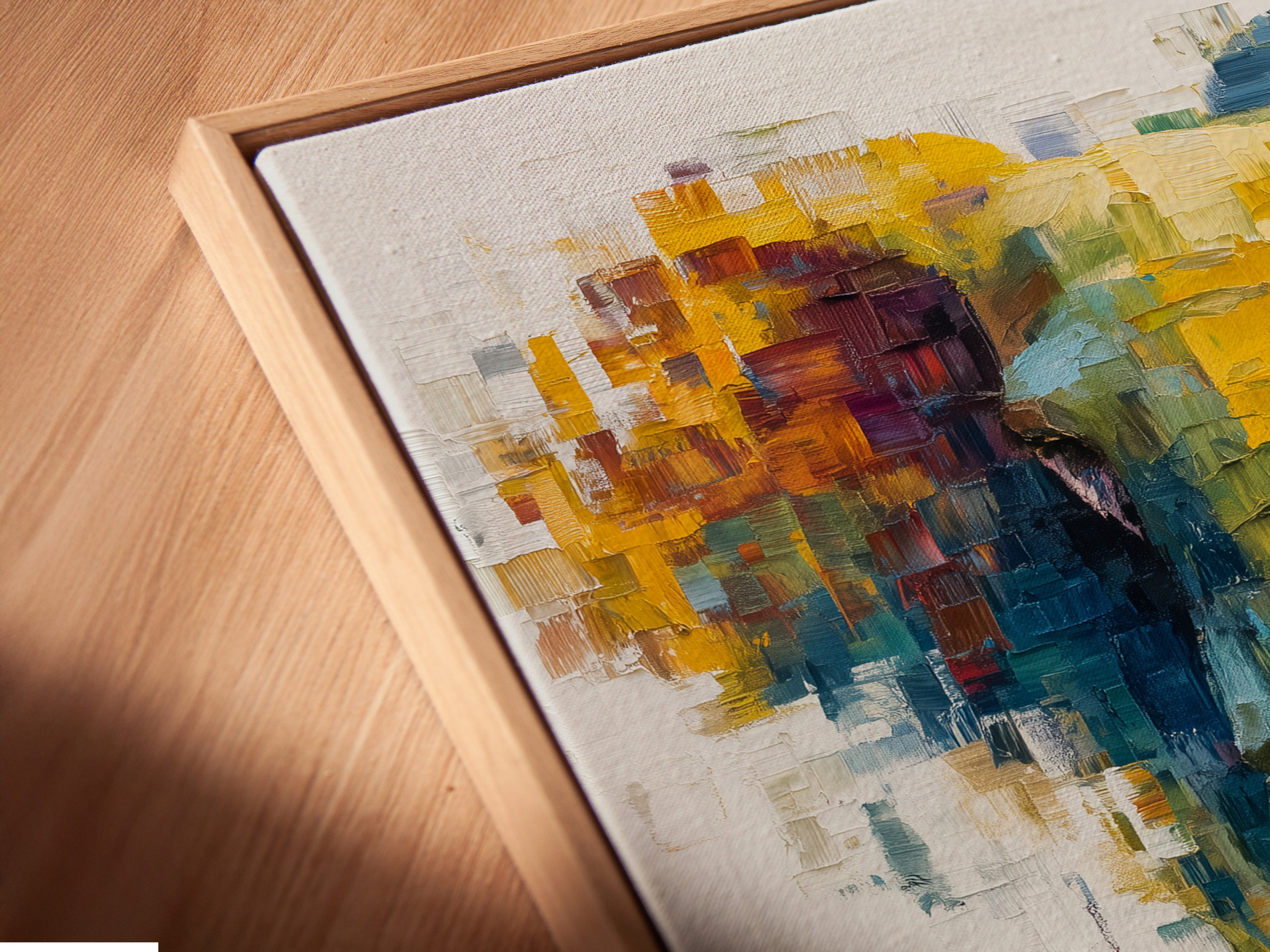 A close-up angle shows a canvas print in a floating frame. The abstract elephant artwork appears to float within the frame. This modern display option adds depth and sophistication to your wall art collection.