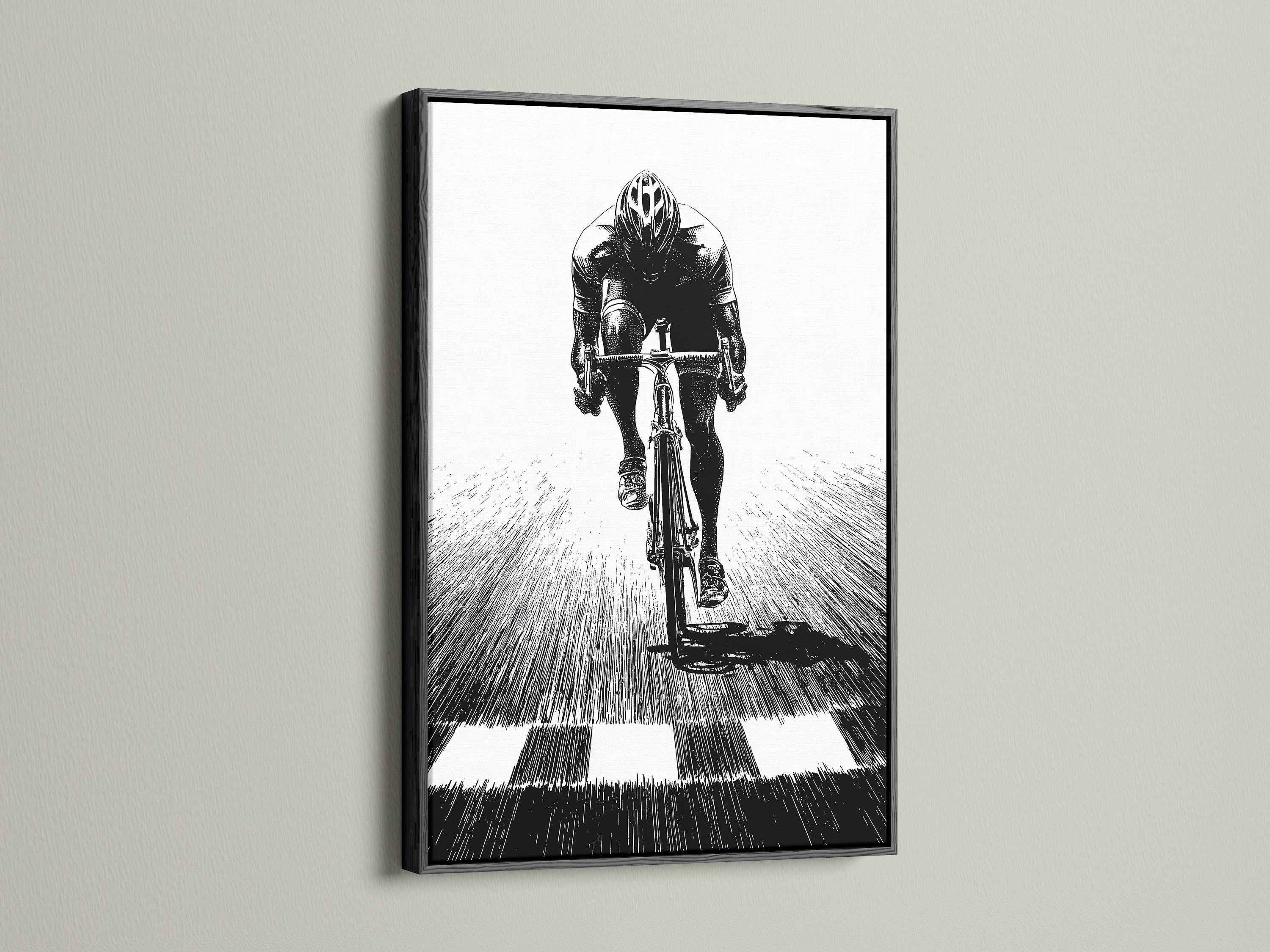 Cycling Art Print in a Black Frame. Black and white sports wall decor for a minimalist look. The black frame adds sophistication to the artwork. This bike canvas print enhances your home office. A perfect addition to training rooms and fitness centers.