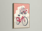 Vintage bicycle artwork with a floral bike print. It is set in an oak frame. The coral pink decor brings a pop of color. This botanical wall art is ideal for any room. The vintage bike poster adds a whimsical touch. A perfect addition to your wall.