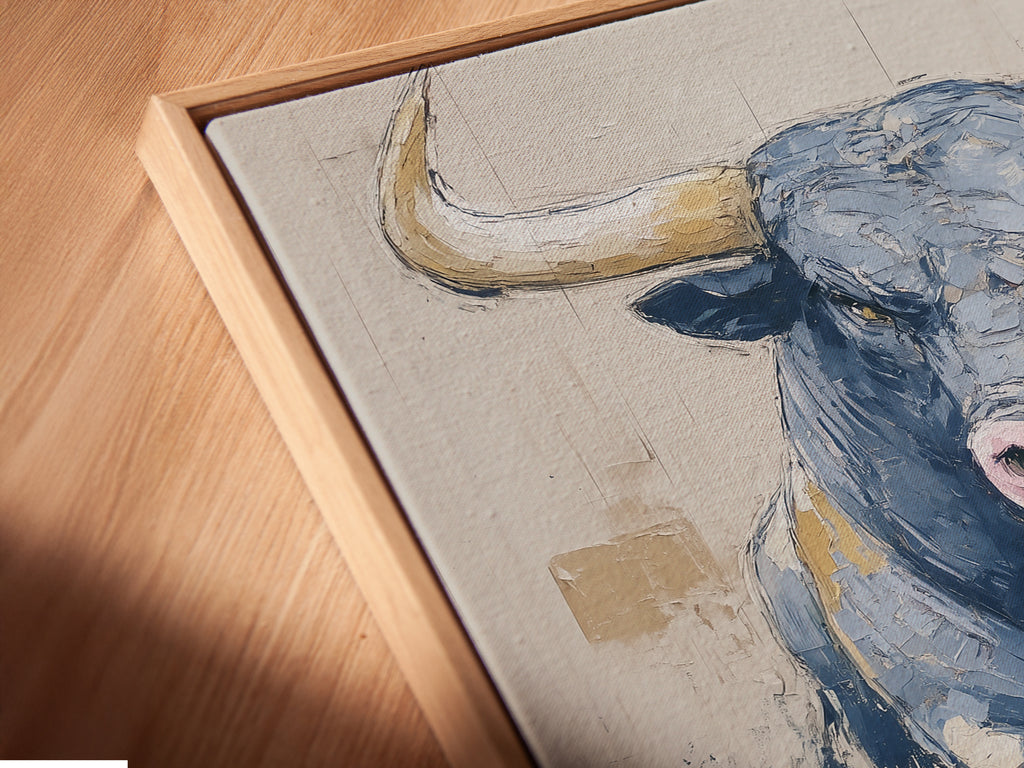 A close up of a canvas print in a floating frame. The bull art is a modern animal canvas. The abstract print is a great piece of farmhouse decor. It is a great piece of art for a study room.