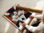 A woman is carefully rolling a fine art poster paper. The paper features a vintage cat portrait. It is surreal animal art. The whimsical gentleman cat is ready for framing. A perfect choice for unique wall art.