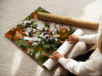 A woman carefully rolls a fine art poster paper. This paper is perfect for high-quality art prints. The poster paper ensures vibrant colors and sharp details. Ideal for creating stunning floral artwork. Order your fine art poster paper today. Create your own masterpiece.