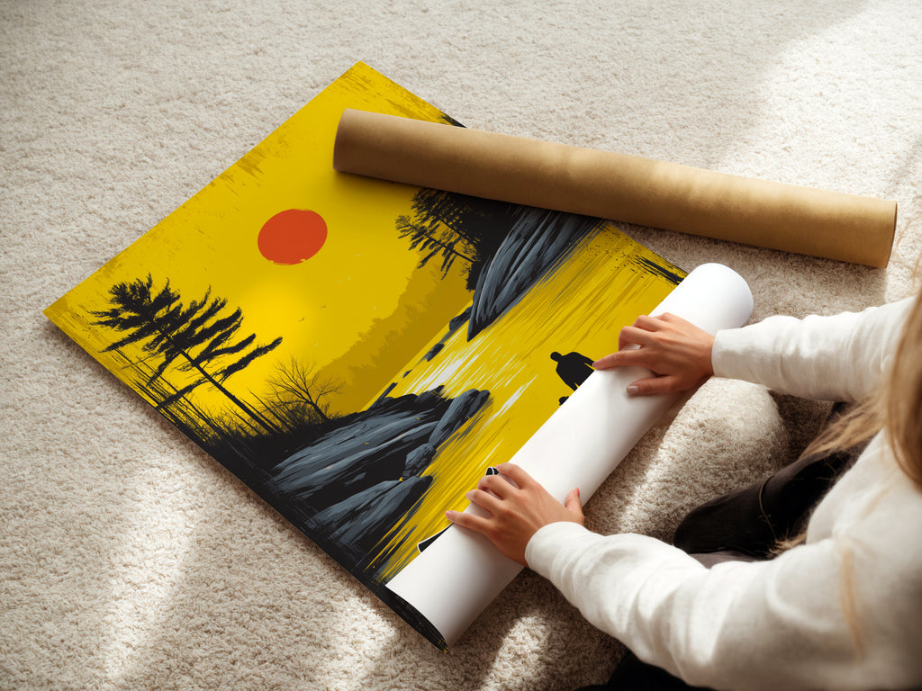 Woman rolling a fine art poster paper featuring sunset lake artwork. The golden landscape shows a father and child. This fine art poster is perfect for modern minimalist and Scandinavian decor. Bring a peaceful serene touch to your living space. Discover our high-quality art paper options.