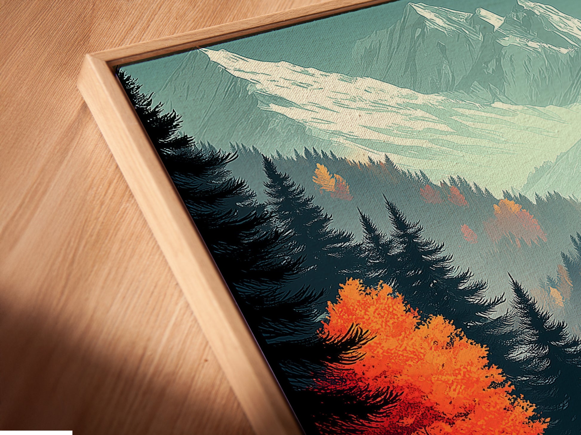 Close-up angled view of a canvas print in a floating frame. The Autumn Forest artwork showcases stunning fall colors. This mountain landscape wall art brings nature indoors. Perfect for modern rustic or eclectic styles enhancing living rooms and offices.