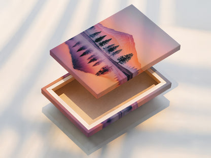A stretched canvas print of a mountain lake. The sunset landscape wall art is vibrant and serene. Perfect modern decor for any home or office. The canvas showcases pastel colors beautifully. Ready to hang and enjoy.