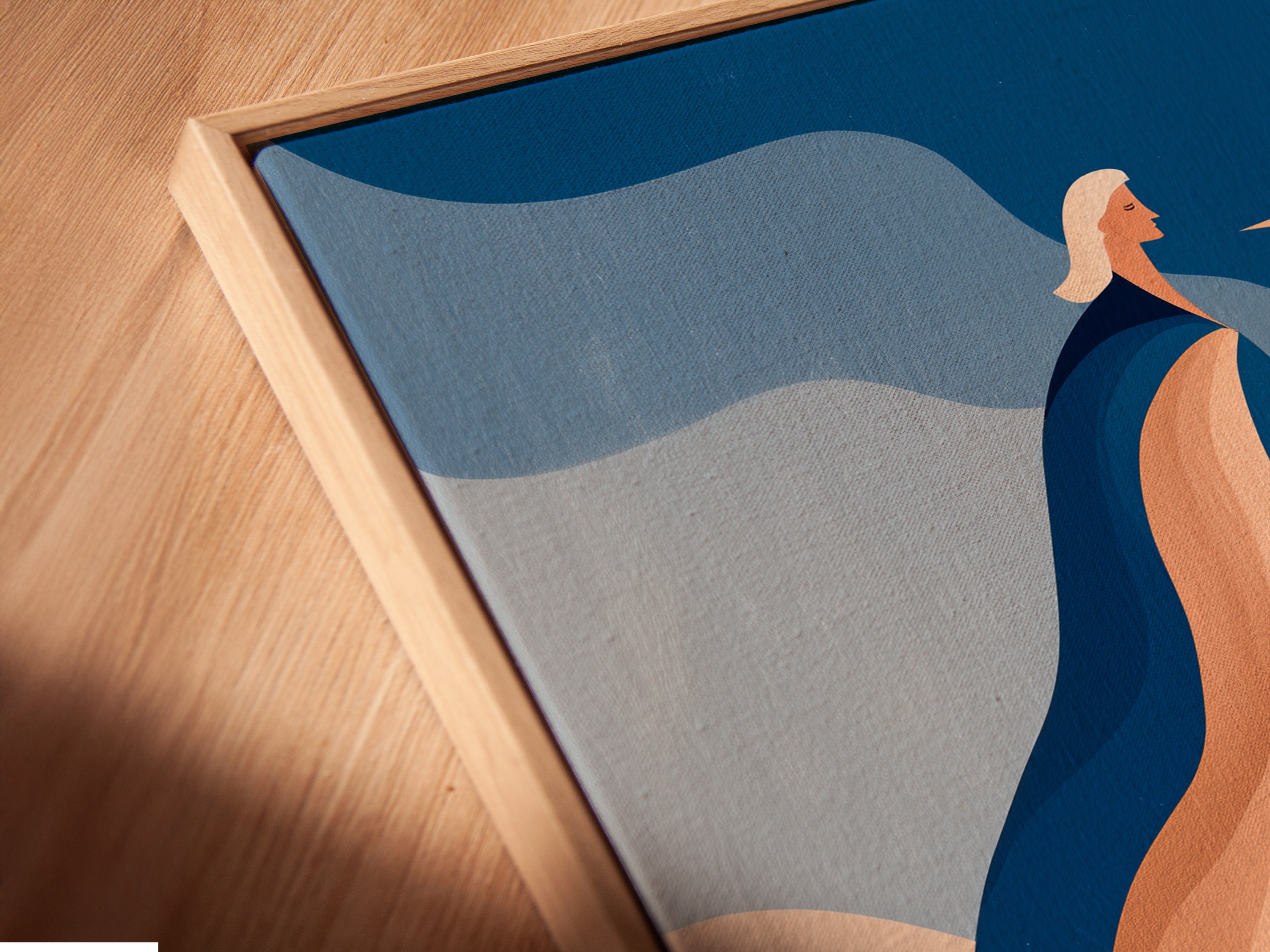 Angled close up of a canvas print in a floating frame. The modern abstract horse art is a blue terracotta masterpiece. This boho equestrian wall art adds sophistication to any room. It complements minimalist boho or eclectic interiors. It is perfect for living rooms bedrooms and entryways