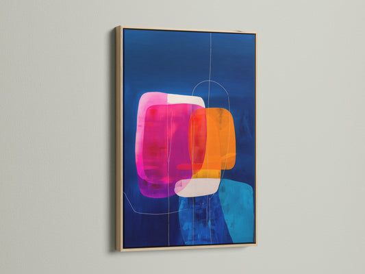 A vibrant abstract geometric print in an oak frame. The artwork features blue orange and pink colors. It hangs on a white wall. Ideal for adding a contemporary touch to your home or office wall decor