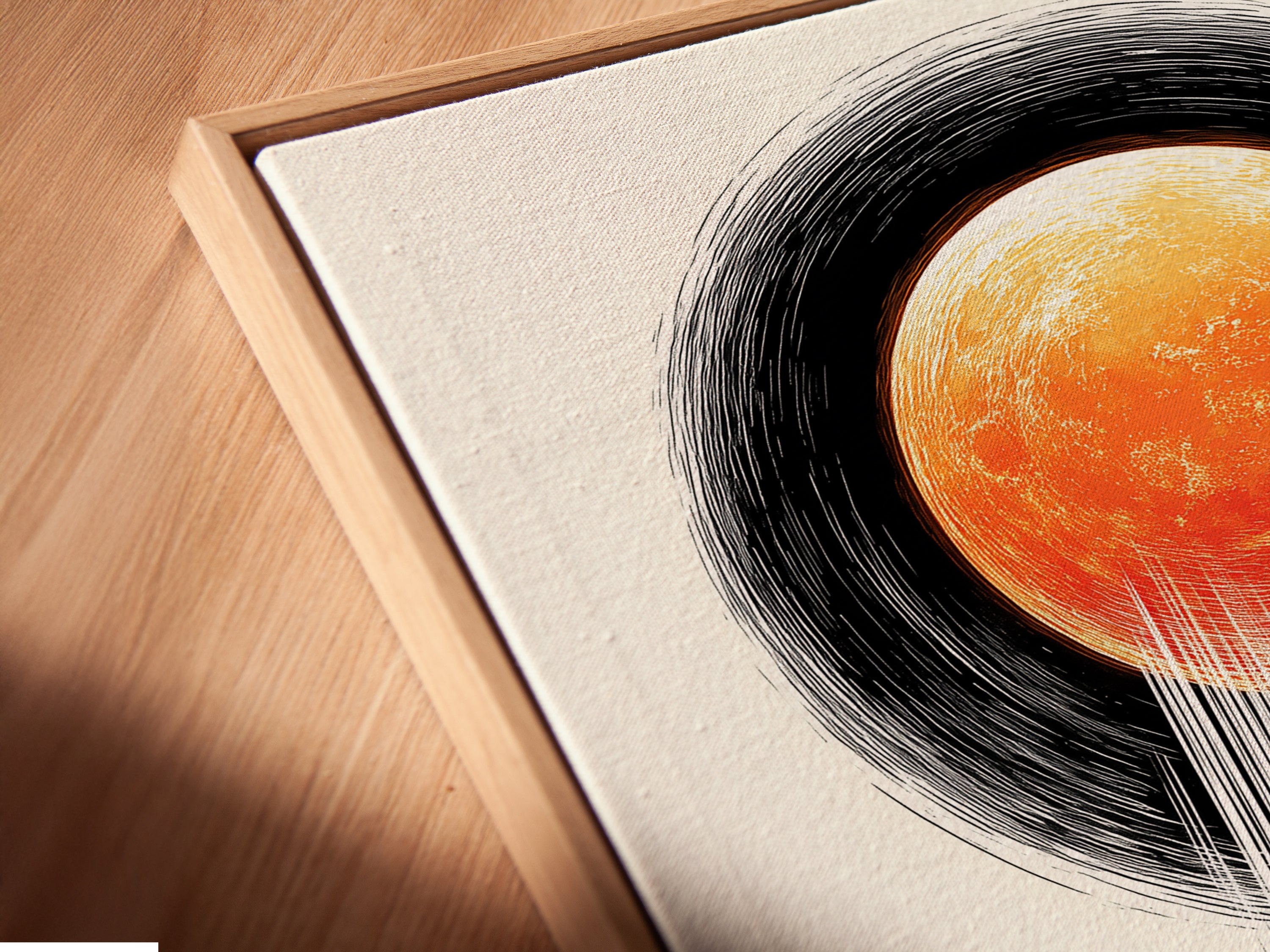 Close up angled view of a canvas print in a floating frame. The surreal eclipse artwork adds modern wall decor to any room. Perfect for homeowners and renters. The man and moon print is a dramatic art piece.