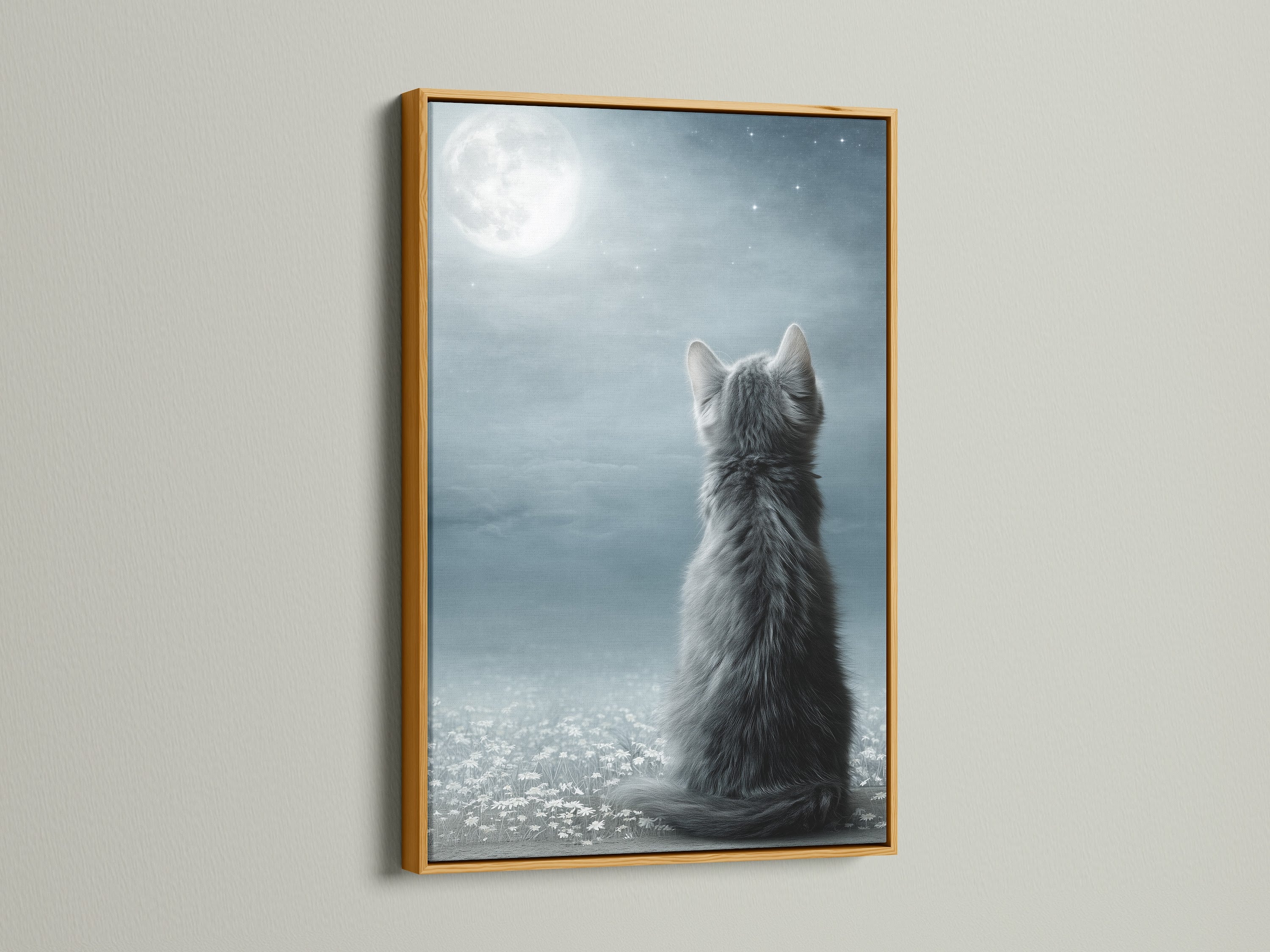 The Cat Moon Canvas Print is featured in a gold frame. The gold frame adds a touch of luxury to the celestial kitten artwork. This whimsical art is perfect for adding a dreamy touch. This wall art is ideal for a nursery or living room. It makes a perfect pet lover gift.