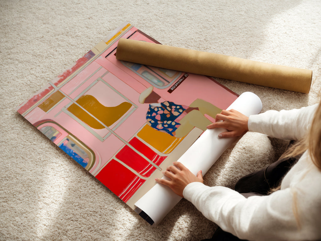 A woman is carefully rolling a fine art poster paper. The paper will be used to create a high-quality Pink Subway Art Print. This poster paper ensures vibrant colors and sharp details. It is perfect for modern urban transit and contemporary apartment decor. The paper is ideal for homeowners and renters.