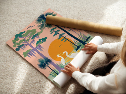 A woman carefully rolls a fine art poster paper. The heron artwork will be printed on this high-quality paper. Ensuring a vibrant and long-lasting nature art print. Perfect for adding a touch of coastal decor to any room.