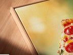 A close-up angle showcases a canvas print of pizza artwork. The print is beautifully set in a floating frame. This modern framing style accentuates the vibrant colors. It makes the food photography stand out. Perfect for a contemporary kitchen or restaurant decor.