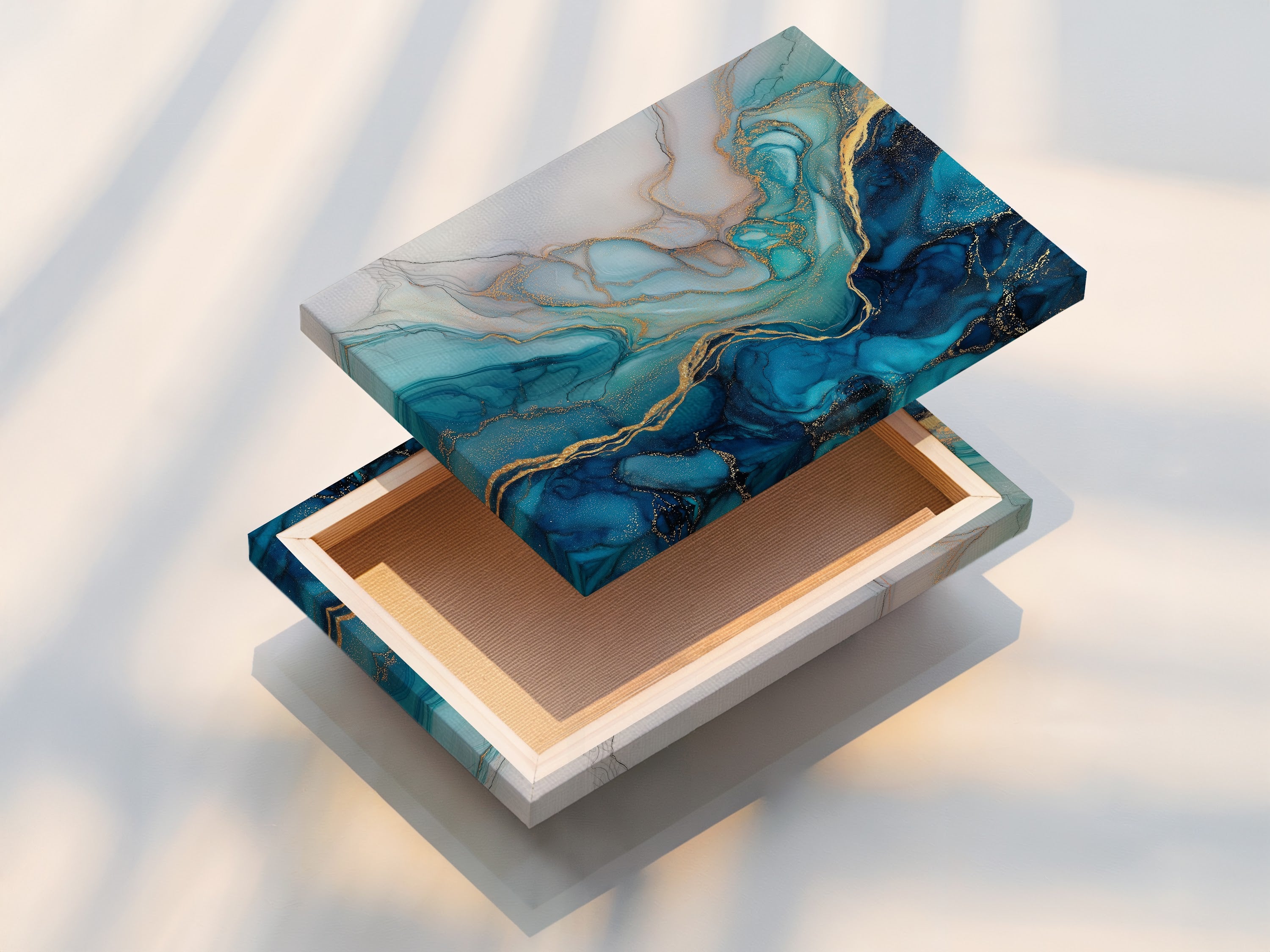 This stretched canvas print showcases a stunning blue abstract artwork. The fluid acrylic texture and gold accents create a mesmerizing effect. Perfect for adding a modern coastal touch to any living space. This piece enhances modern bedroom decor with its teal and marble print.