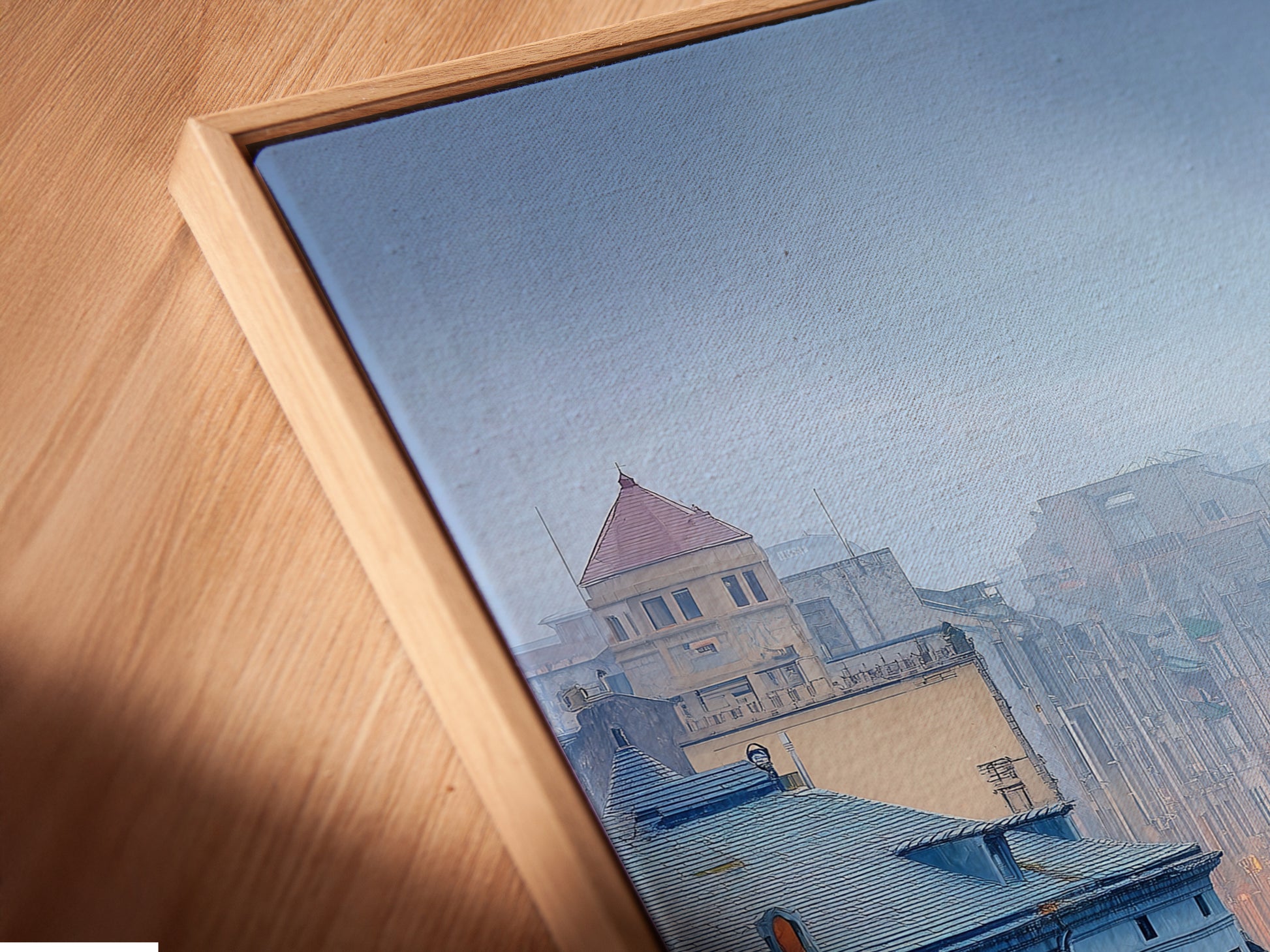 A close-up angled view reveals a canvas print in a floating frame. The artwork features a cityscape. This European city art enhances your space. The floating frame adds a modern touch.