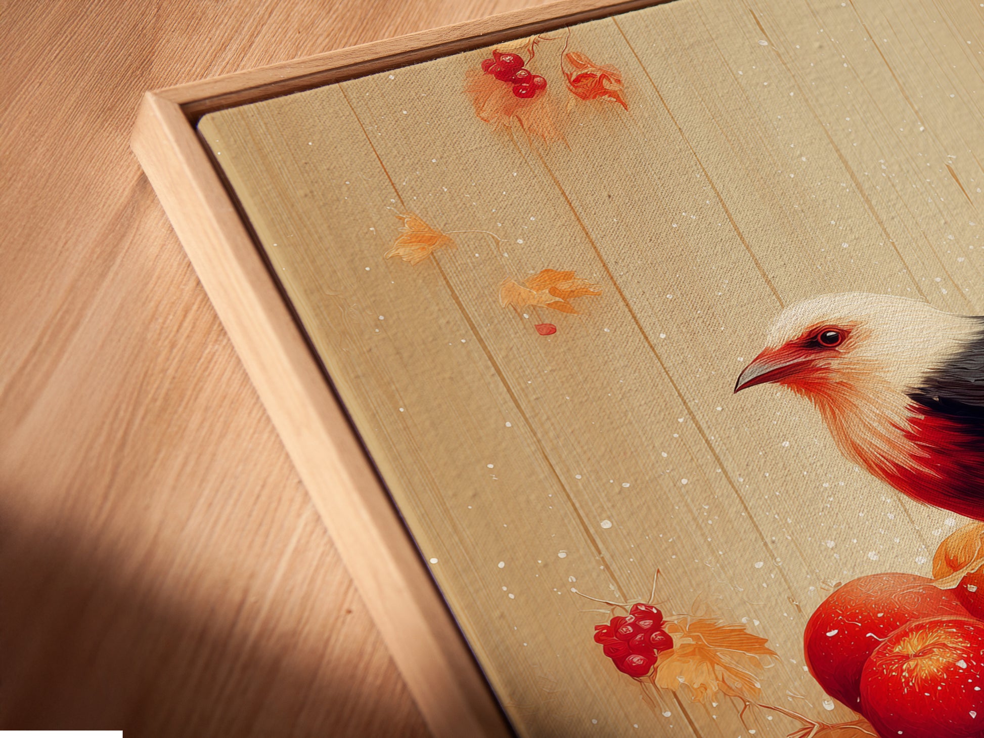 Close-up of a Bird and Apples canvas print in a floating frame. The artwork is a rustic fall still life. This piece is ideal for kitchen decor. The floating frame gives the art a modern look. It showcases a bird perched on a bucket of red apples. This close-up highlights the artwork's fine details.
