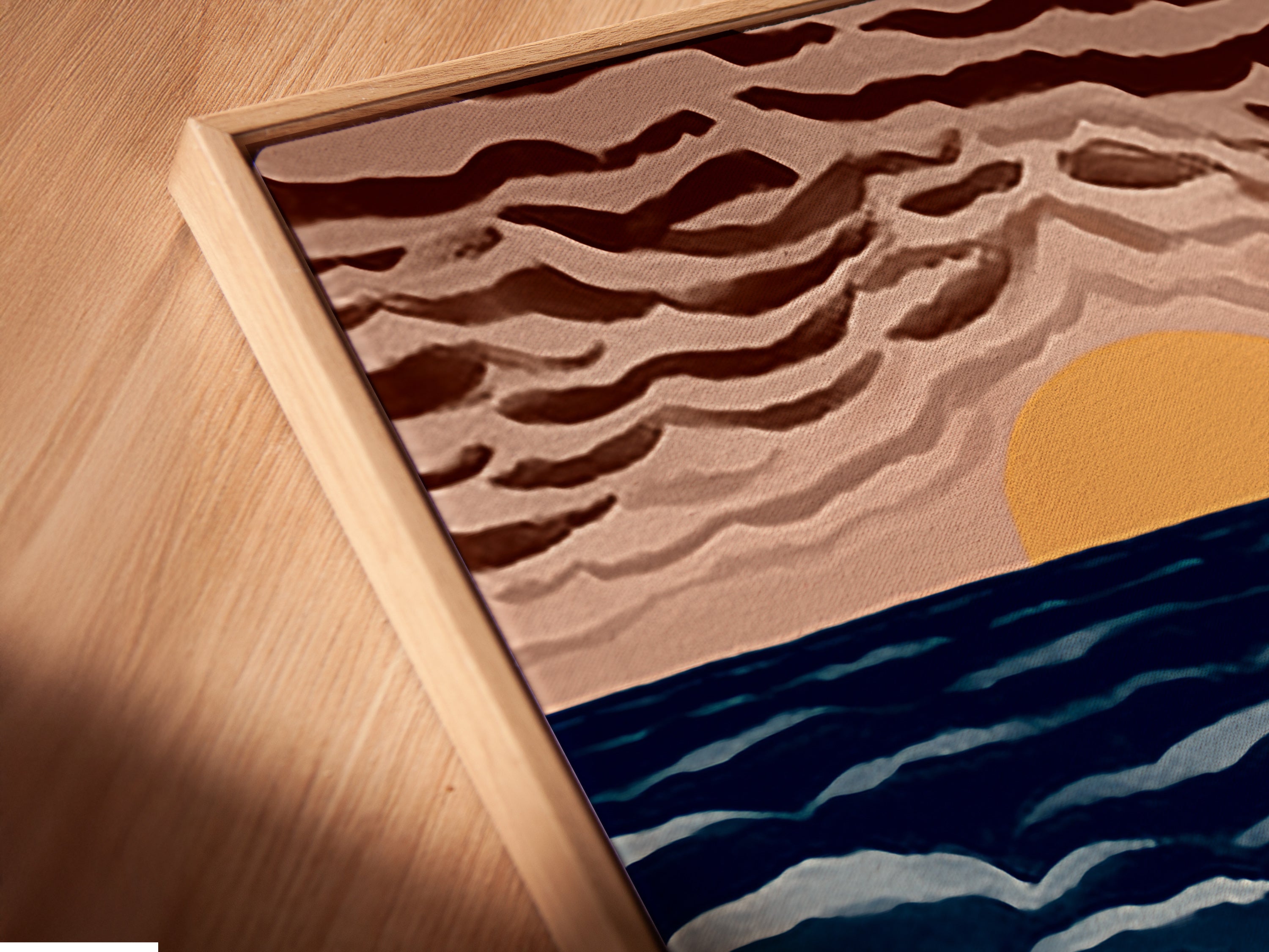 This is a close-up of our canvas print in a floating frame. The art depicts a seaside cafe. People are enjoying the sunset and ocean view. It's perfect coastal artwork.