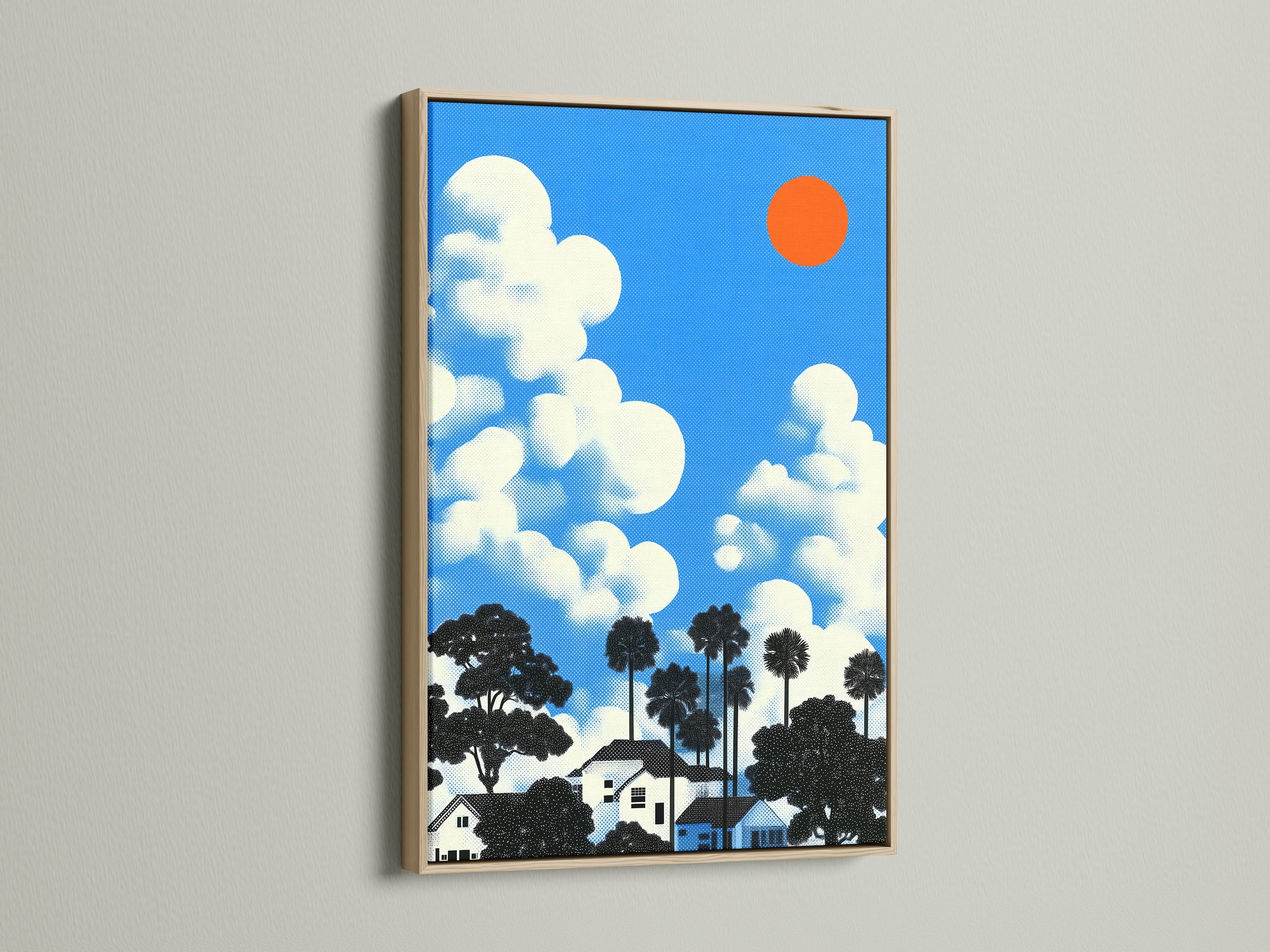 A piece featuring a house and clouds artwork with an oak frame. The oak frame enhances the retro pop art style. This blue sky print brings a sunny day feel to any space.