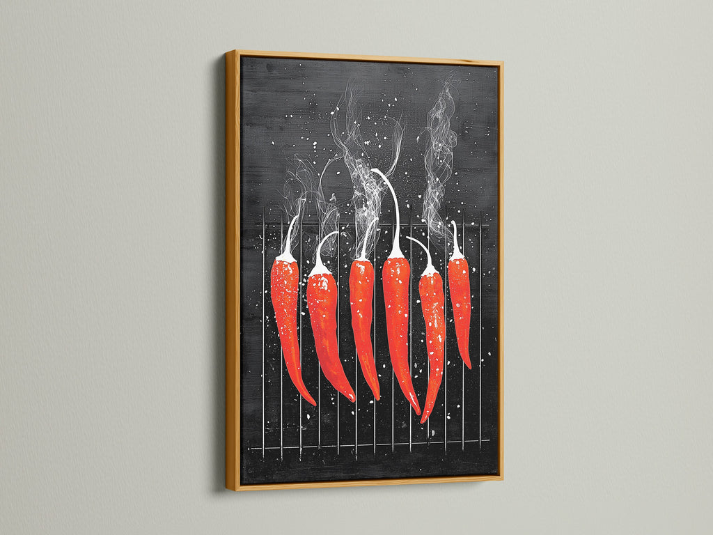 A red hot chili pepper artwork is framed in gold. The art is displayed on a clean white wall. The gold frame enhances the artwork's modern aesthetic. This culinary art is perfect for kitchens and dining rooms. This piece is ideal for food lovers.