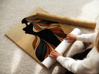 A woman carefully rolls a fine art poster paper. The paper is ready for printing the silhouette artwork. This showcases the attention to detail and quality. The fine art paper ensures a premium finish. Ideal for creating stunning bohemian wall art. This artwork is ideal for minimalist and contemporary settings.