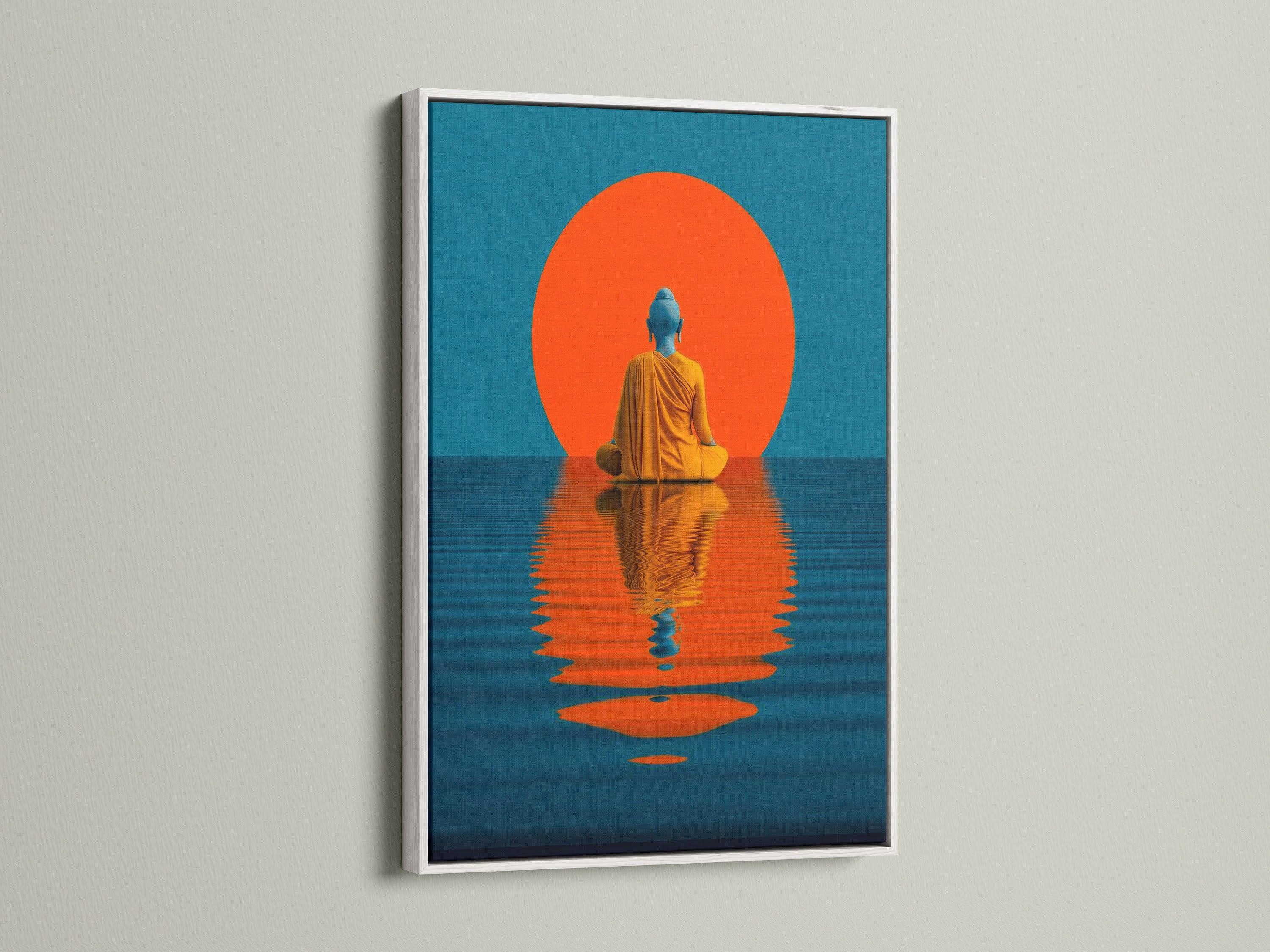 This image shows the teal and orange Buddha artwork with a white frame. The artwork is displayed on a white wall. This modern wall art is perfect for minimalist and Scandinavian styles. It provides a serene and mindful touch to bedrooms and meditation spaces.