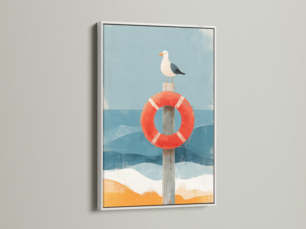 Artwork featuring a seagull perched on a red life preserver. The art is framed in a white wooden frame. The artwork has a coastal nautical theme. This simple frame accentuates the art.