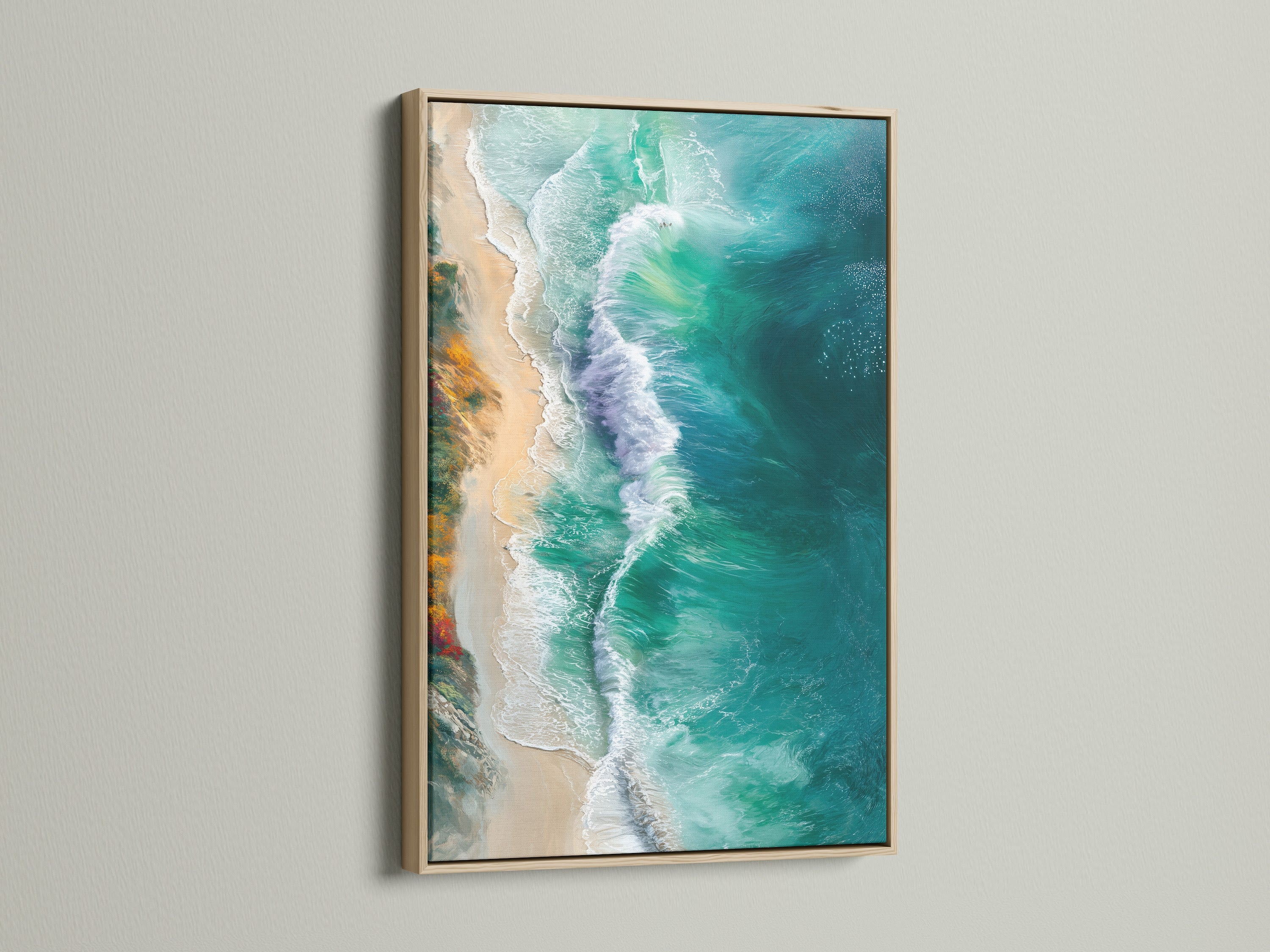 Ocean wave art print in an oak frame. The artwork features turquoise teal aerial photography. This beach canvas print enhances bedroom decor. Elevate your space with coastal style artwork.
