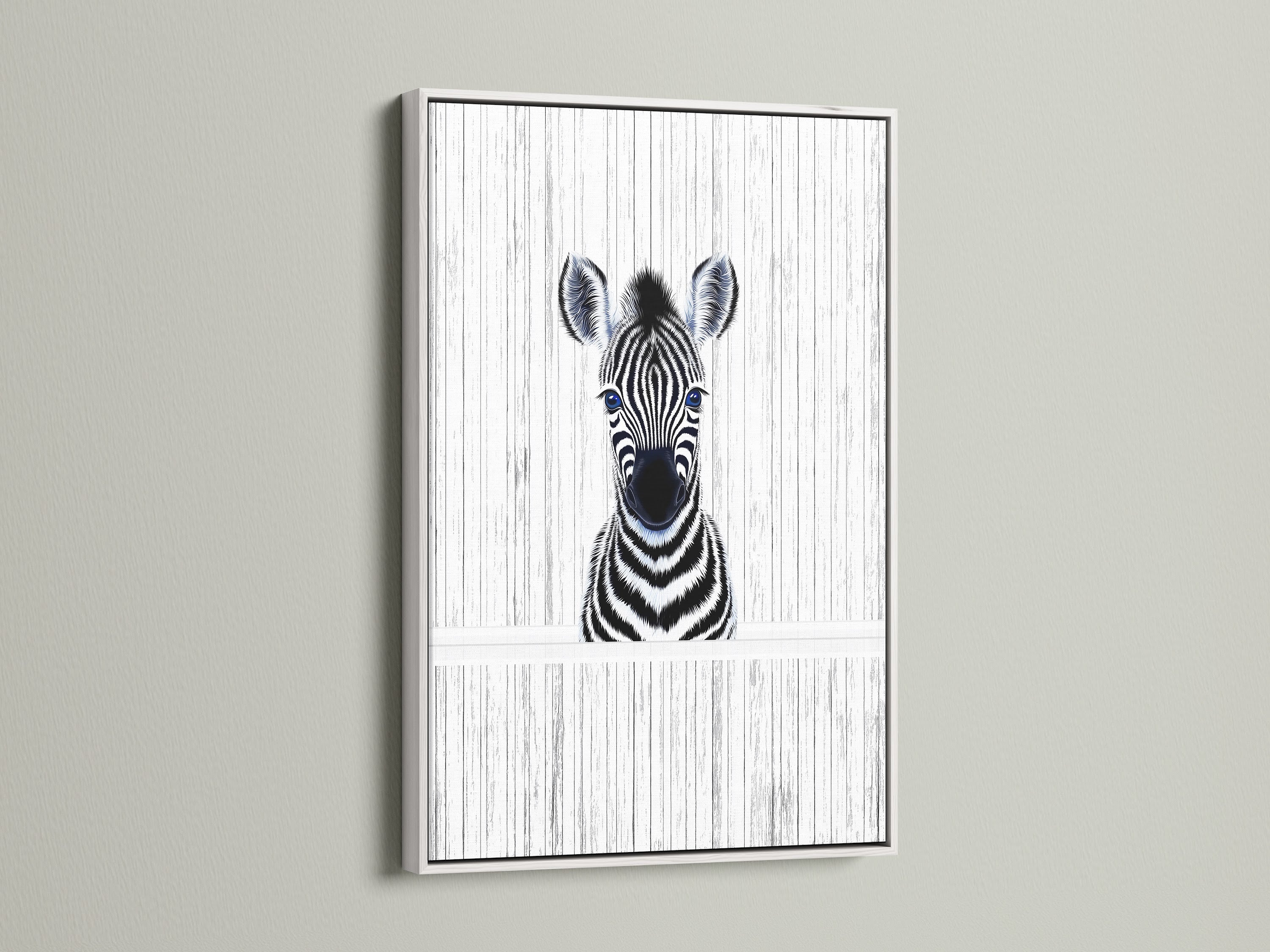 A delightful Baby Zebra artwork in a white frame. The black and white animal art complements kids room decor. This zebra poster brings a minimalist touch to a safari nursery. The white frame adds a clean contemporary look.