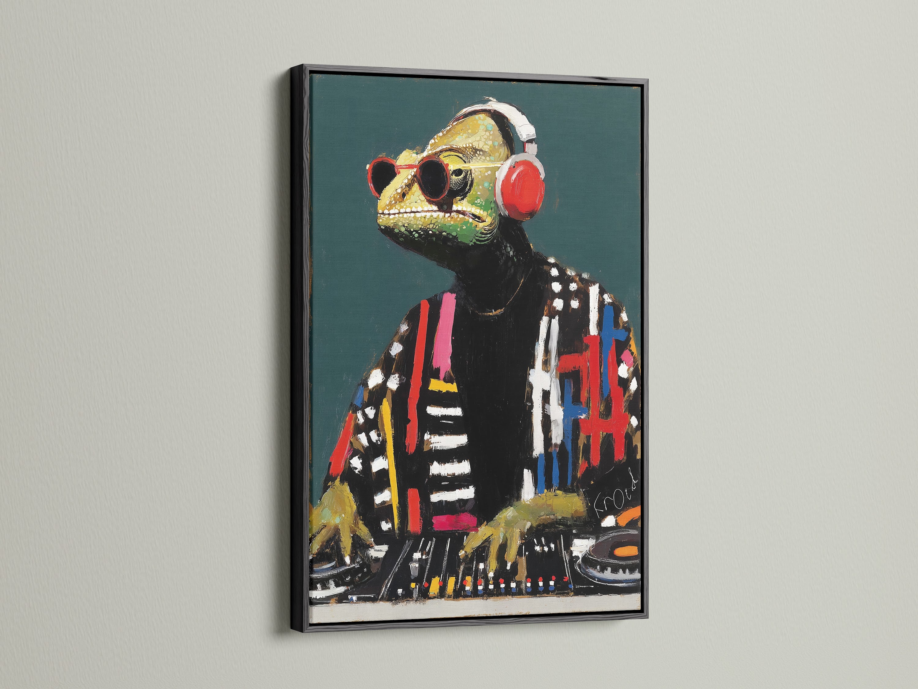 DJ Iguana canvas art in a black frame. This black frame emphasizes the modern animal canvas print. The dark frame makes the colors pop. It's ideal for a creative office or music room art setting. This is cool animal art.