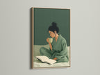 Woman Reading Art Print with an oak frame.  Enhance your space with this sage green wall art. This piece adds a touch of serenity to any room. Ideal for cozy home art.