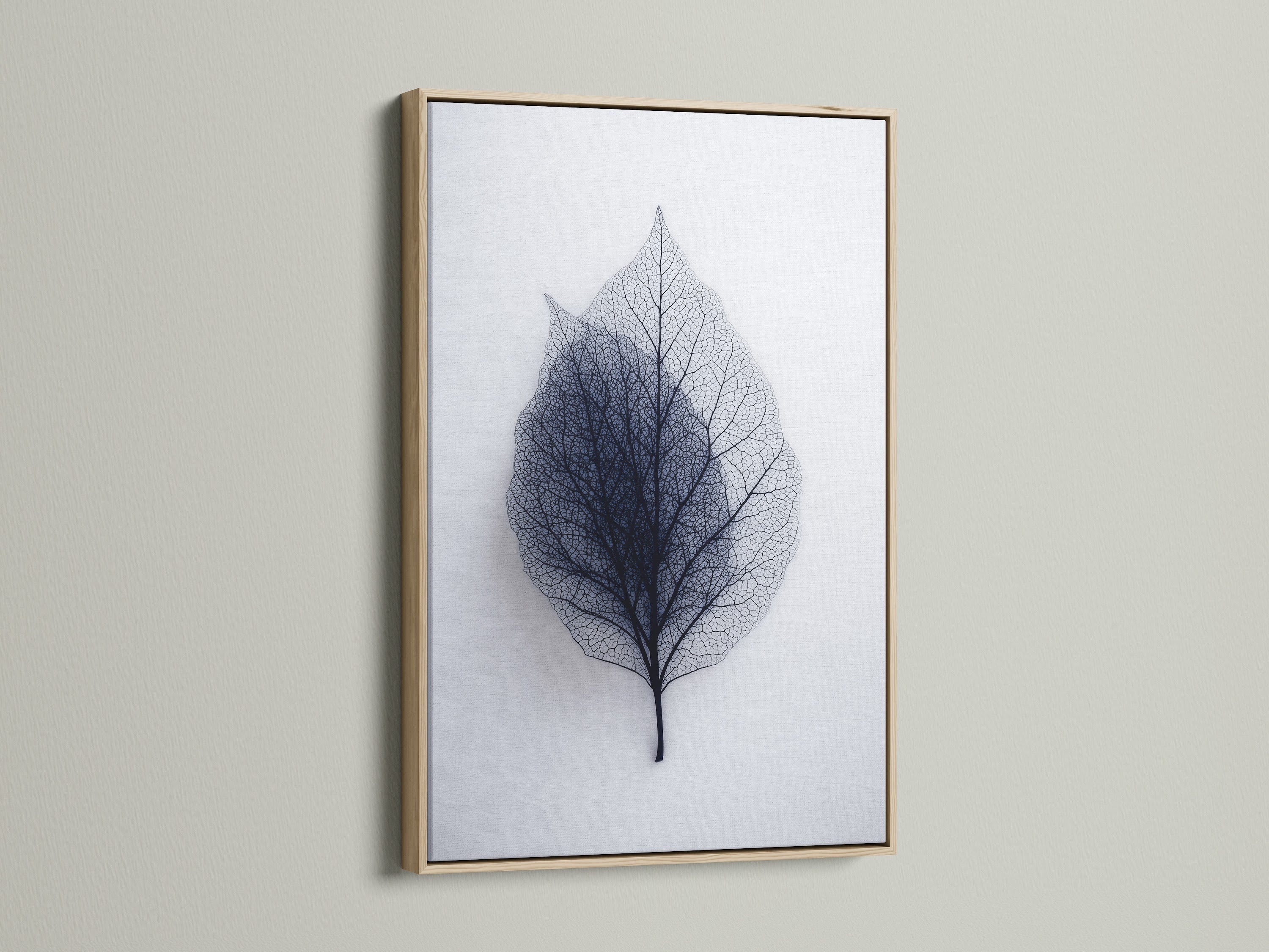 A close-up of leaf art in an oak frame. The oak frame enhances the artwork's natural beauty. This frame is perfect for rustic or traditional decor. Display your art in a stylish oak frame.