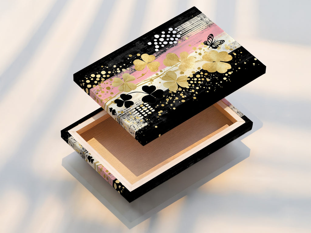 A stretched canvas print of the Clover Canvas Print art. This ready-to-hang modern botanical artwork is perfect for instant wall decor. Add a touch of gold and black floral art to your home.