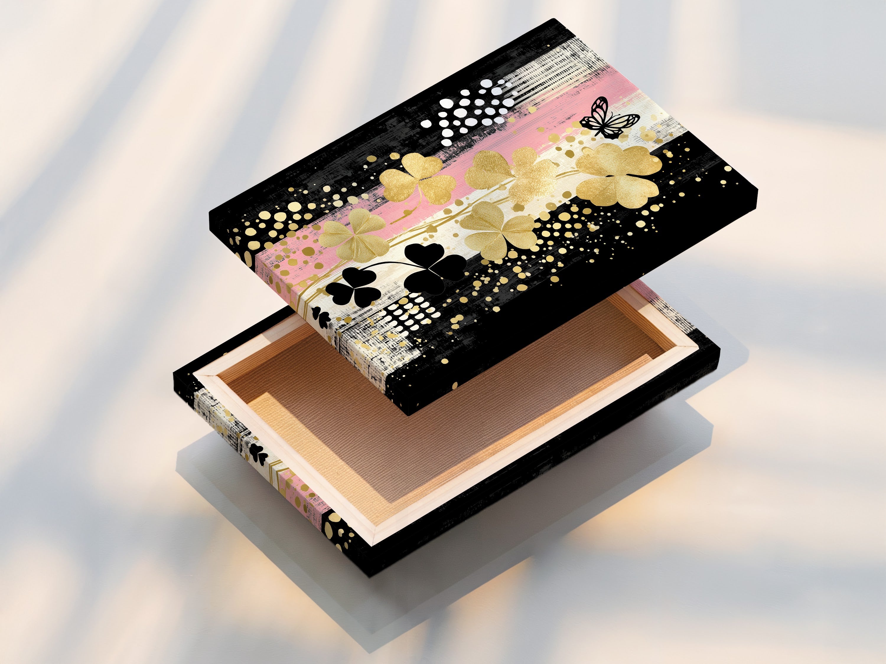 A stretched canvas print of the Clover Canvas Print art. This ready-to-hang modern botanical artwork is perfect for instant wall decor. Add a touch of gold and black floral art to your home.