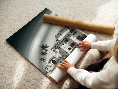 A woman is carefully rolling a fine art poster paper. The fine art poster paper ensures high-quality prints with vibrant colors. This paper preserves the details of the Coastal Village artwork. This provides a stunning visual experience for years to come.