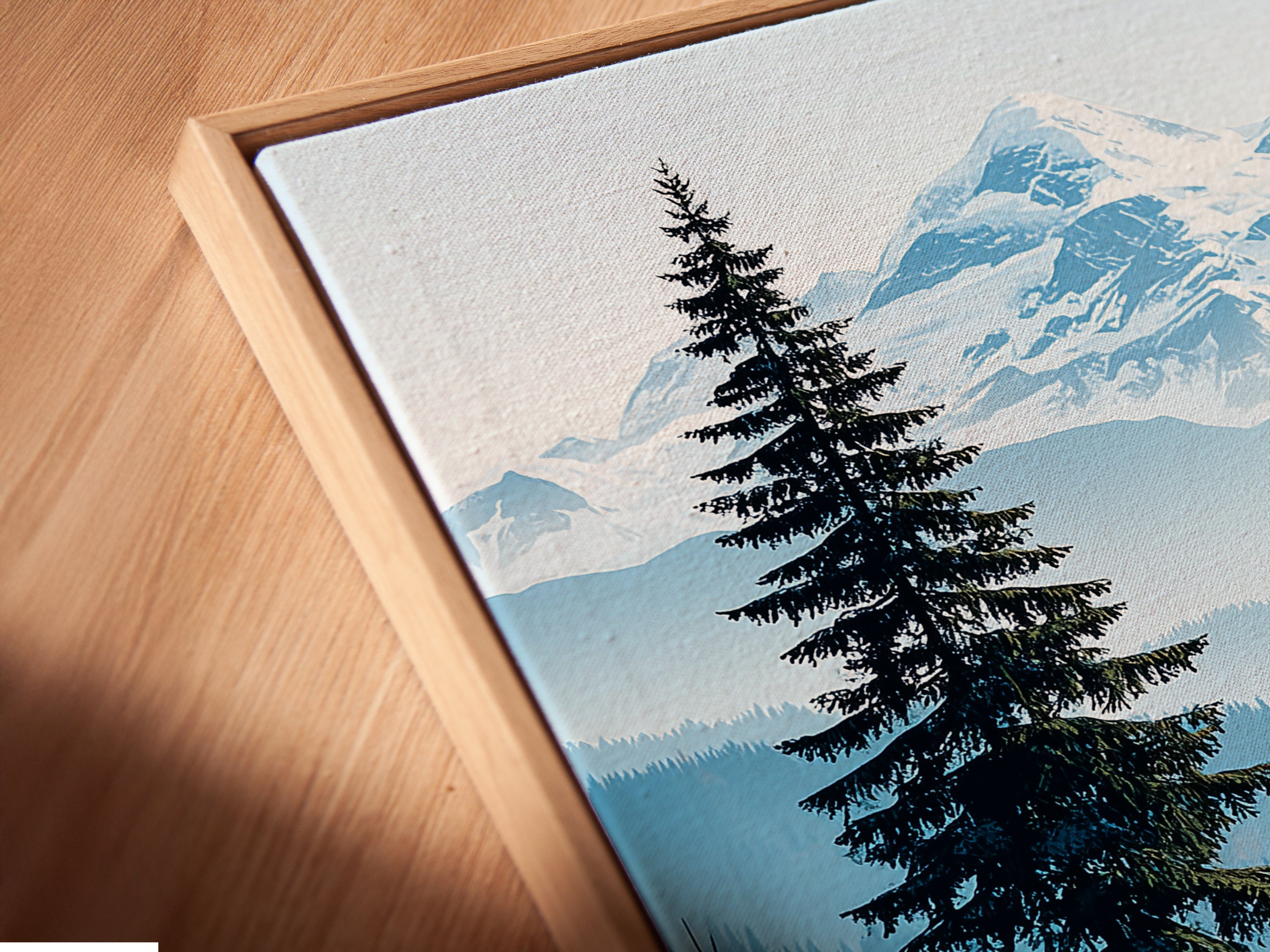 Close-up of a Mountain Forest canvas print in a floating frame. The floating frame gives a modern look. This nature print is ready to hang. It is perfect for living room wall art. Enjoy the beauty of rustic decor.