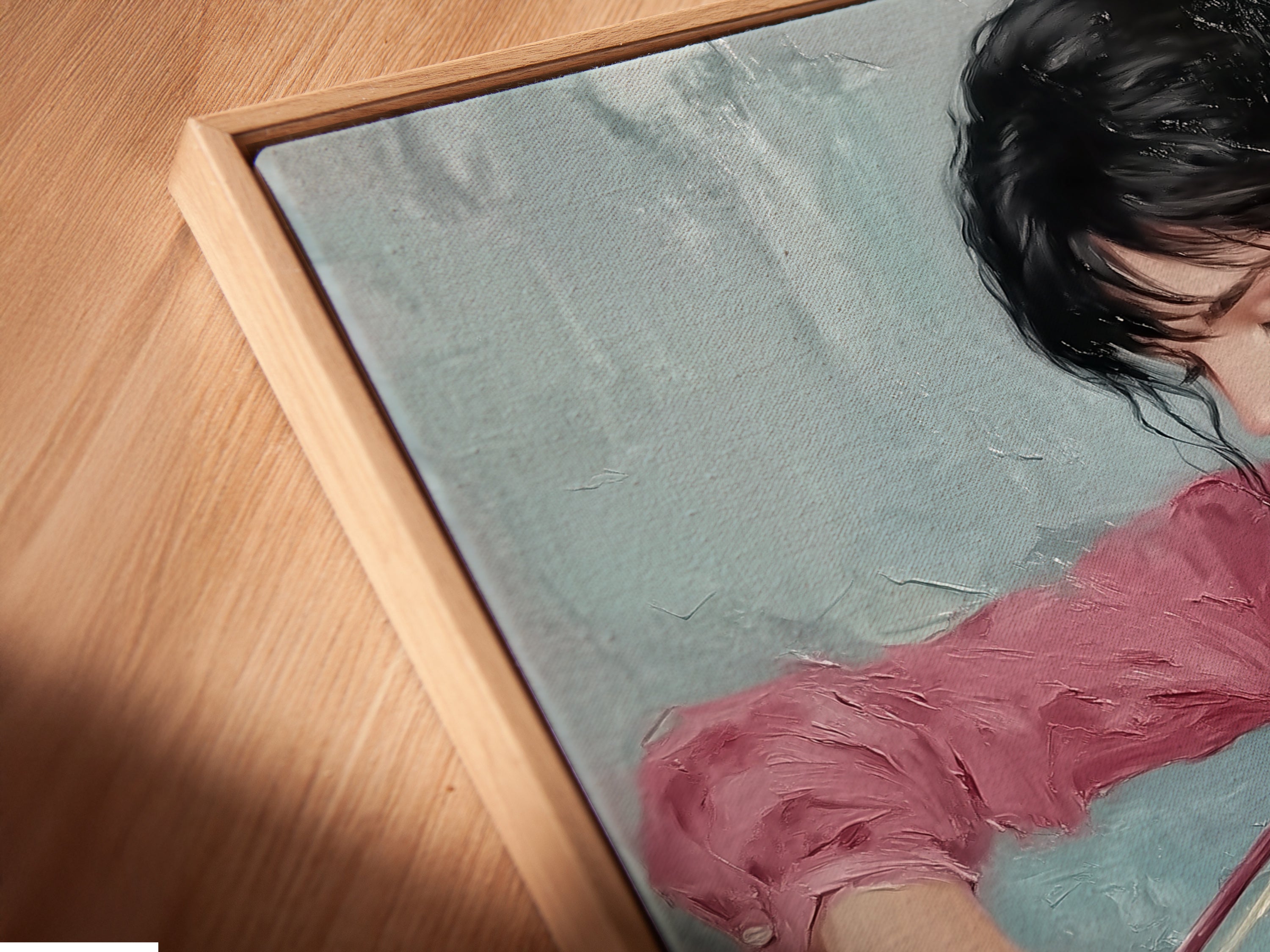 A close-up angled view of the canvas print in a floating frame. This violinist art piece is a modern pink and teal wall artwork. The floating frame enhances the artwork. This is ideal for music rooms. The artwork is a unique gift for musicians.