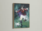 A soccer player canvas art piece with an abstract sports theme is displayed in an oak frame. The artwork is a dynamic action painting. This sports wall art adds a touch of sophistication. It enhances living rooms bedrooms offices or man caves.