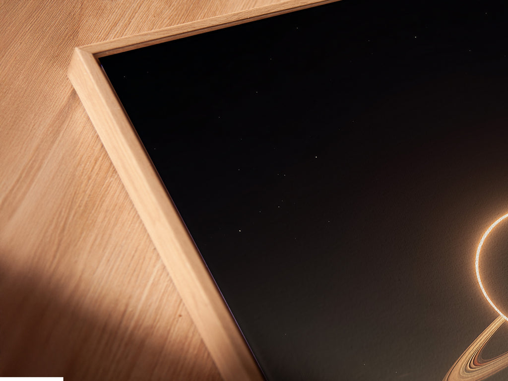 A close-up angled view of a canvas print. It's set in a floating frame. The floating frame gives the artwork a modern appearance. It separates the art from the wall. The unique frame enhances the art's appeal.