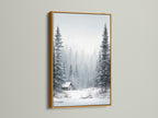 Winter Forest artwork in a gold frame. The art features a snow landscape with pine trees. A cozy cabin adds a touch of warmth. This framed art brings elegance to any room. Perfect for rustic and primitive styles.