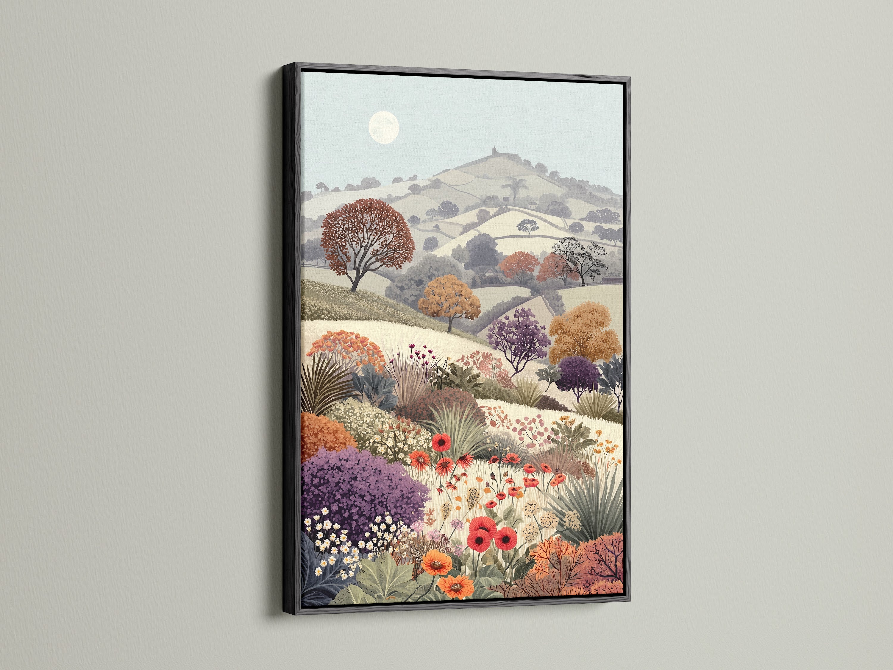 Floral Meadow artwork with a black frame. The vintage landscape features a flower field and countryside scenery. This botanical artwork brings a touch of rural charm. The serene pastel colors and wildflower print add a cottagecore feel to any room. It's great for study wall decor and nature enthusiasts