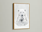 This gold frame accentuates the polar bear art. The monochrome animal canvas adds a touch of elegance. This bear family print makes a statement in any contemporary nursery or living space.