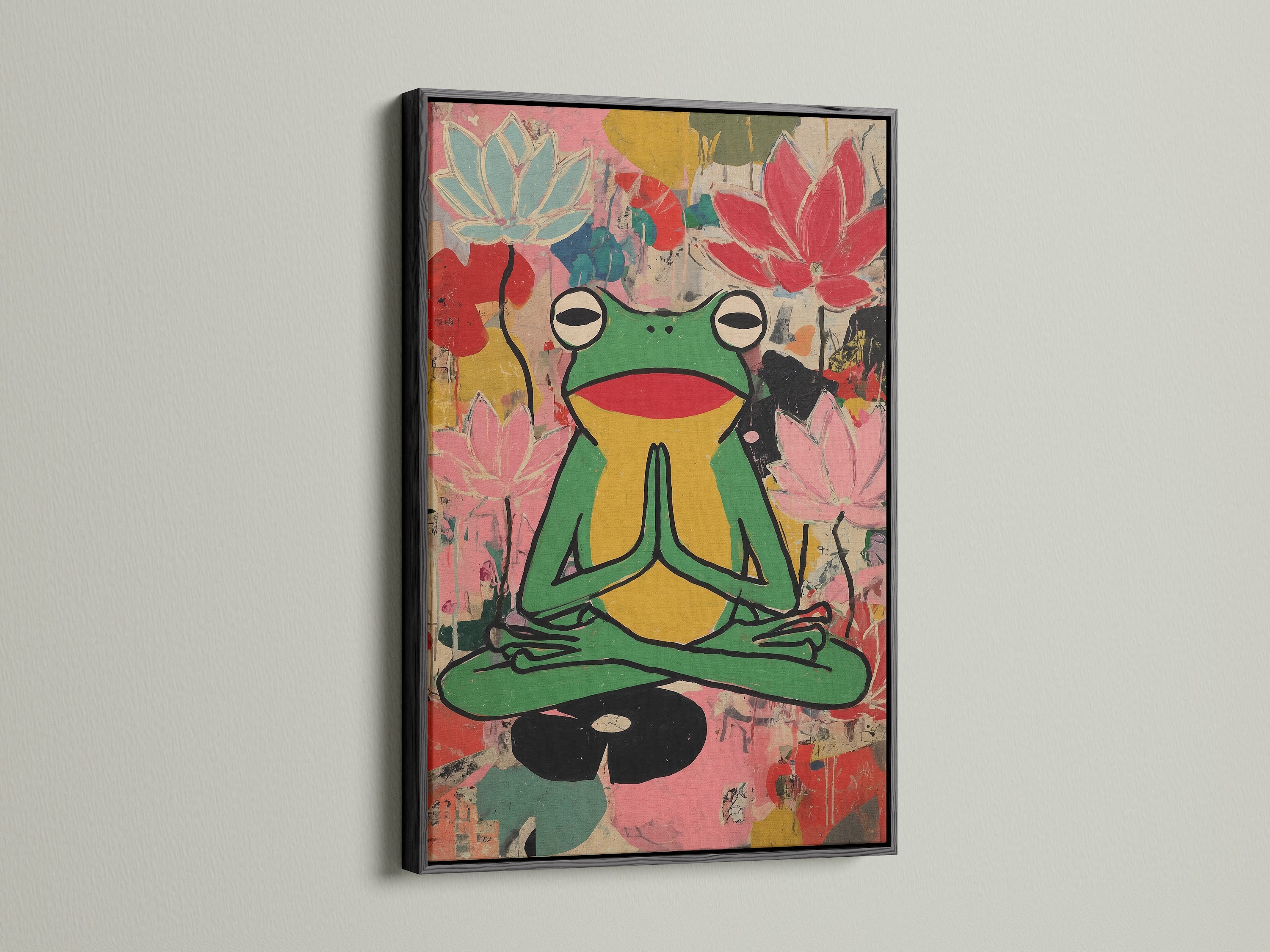 Zen Frog Canvas artwork in a black frame. This meditation lotus wall art brings colorful yoga studio decor for mindfulness. It's perfect for wellness spaces and art lovers. The artwork complements eclectic boho contemporary styles