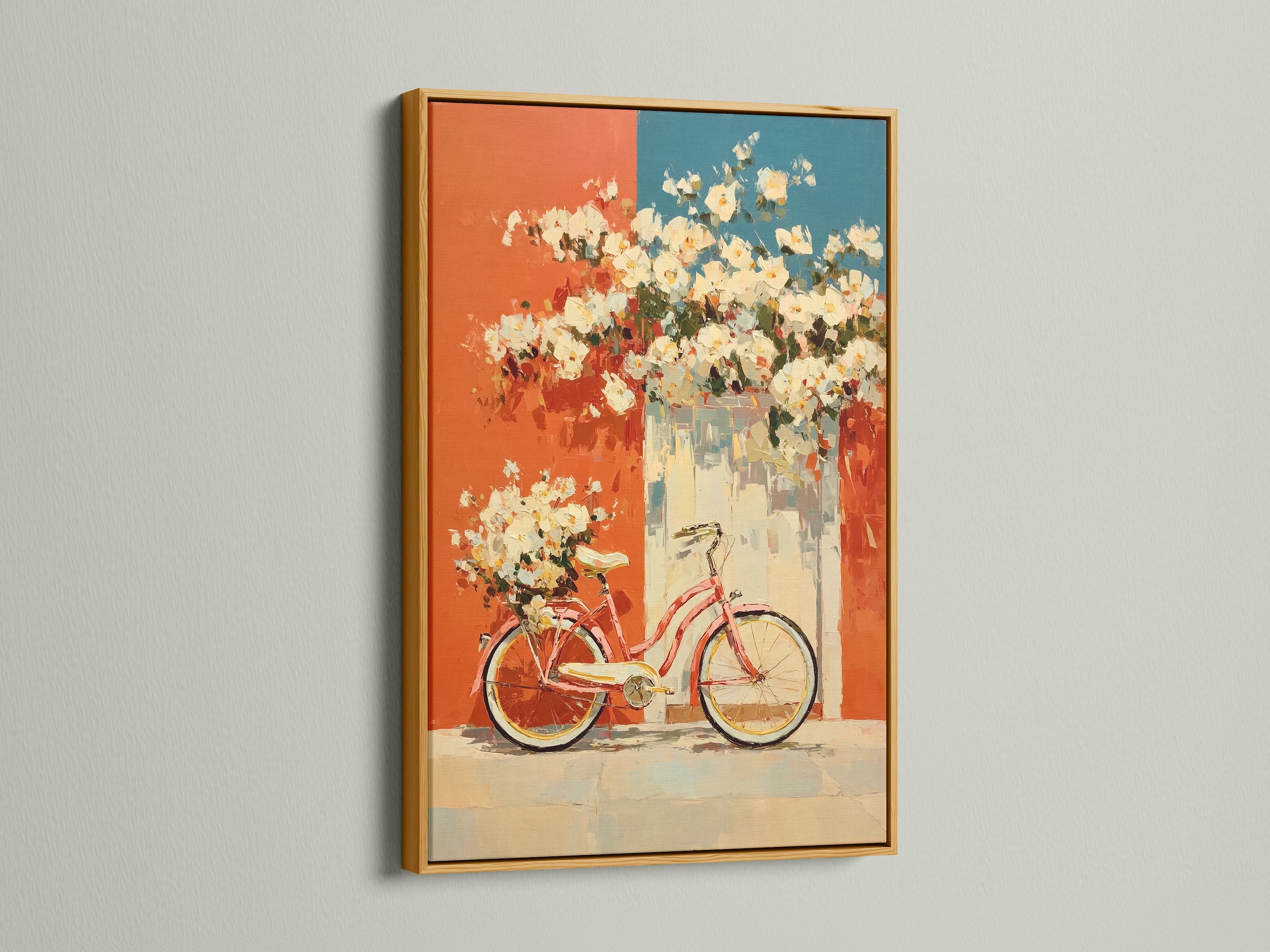 Vintage bicycle artwork displayed in a gold frame. The artwork features floral accents in coral and teal. This retro poster adds a touch of mid-century style to any kitchen or living room. The gold frame adds a touch of elegance and sophistication. It is perfect for adding a distinctive touch to your home decor.