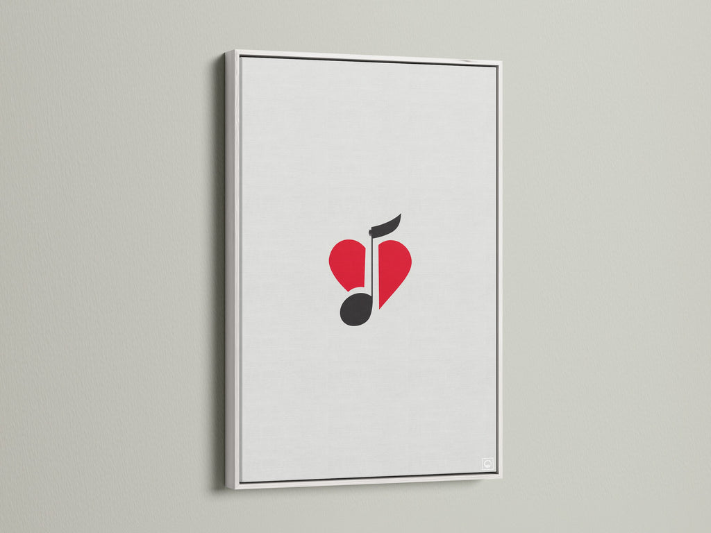 The music note heart art is framed in a white frame. This minimalist piece adds a touch of modern elegance. It will enhance any room. The red and black colors create a striking visual impact.
