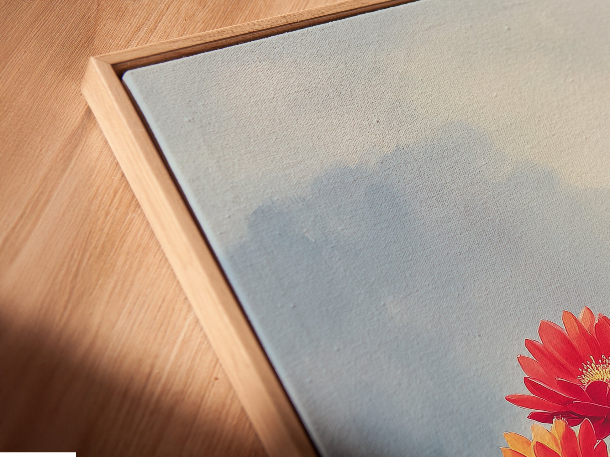 A close-up of a canvas print in a floating frame. The Floral Garden art piece adds depth and style. Perfect for adding a contemporary touch to your home decor. Explore our art prints now.