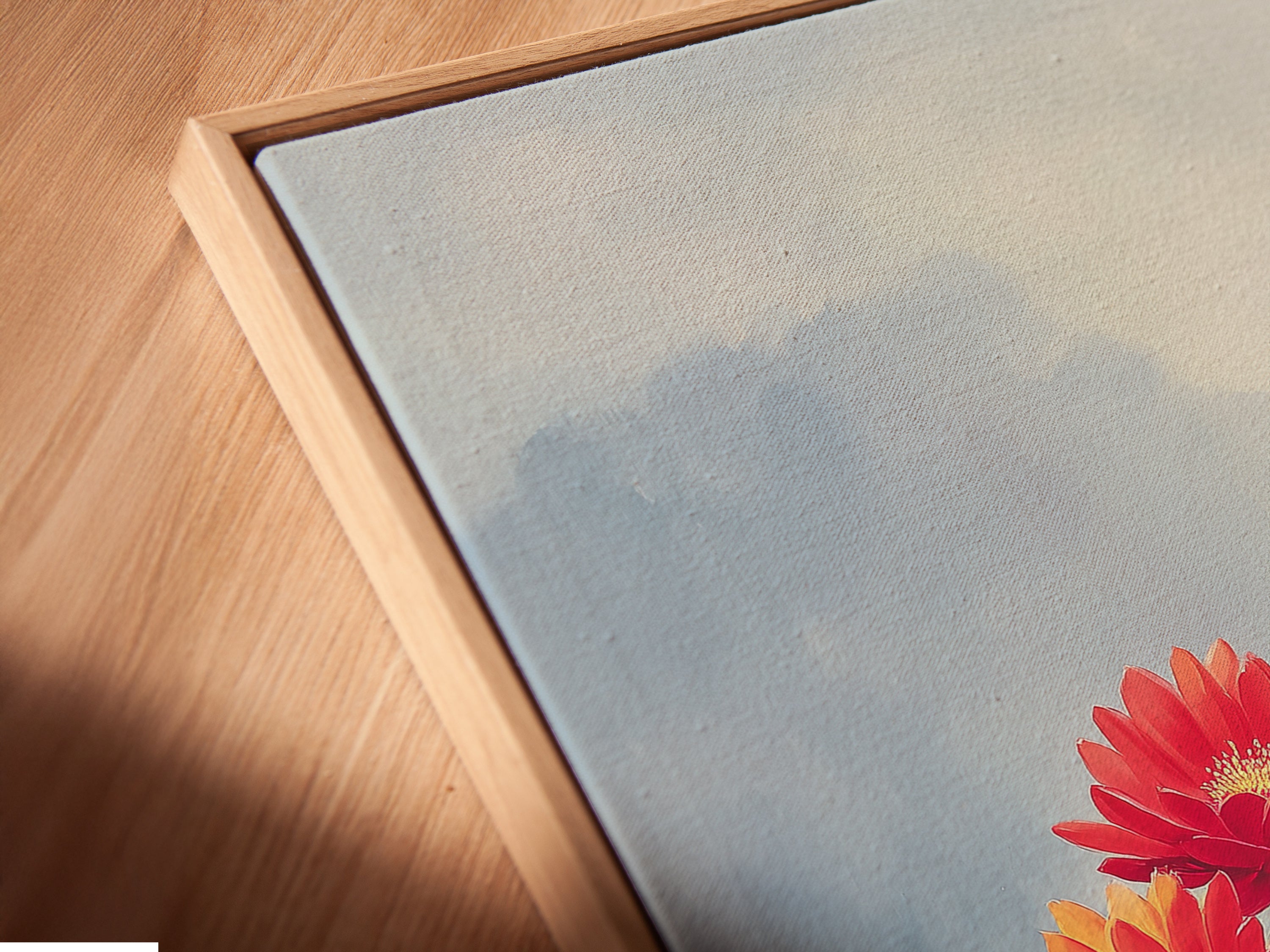 Close-up of a canvas print in a floating frame. The botanical artwork adds depth and texture. This desert flower art complements a southwestern style. The wildflower print is perfect for creating a modern and stylish display.